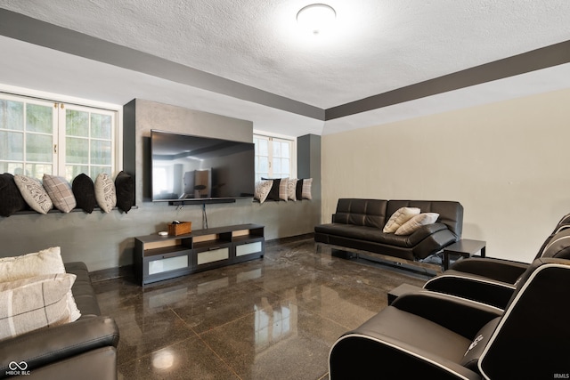 4601 W Legacy Dr, Muncie, IN 47304 - living area featuring a textured ceiling, granite tiled floors, and plenty of natural light