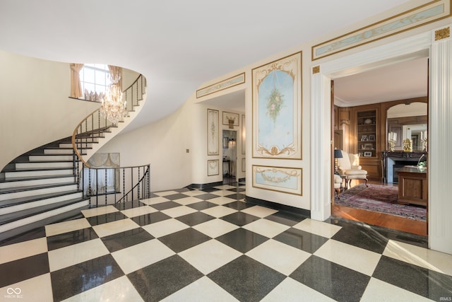 4601 W Legacy Dr, Muncie, IN 47304 - foyer with stairway, a chandelier, baseboards, and tile patterned floors