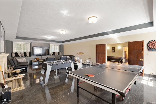 4601 W Legacy Dr, Muncie, IN 47304 - rec room with granite floors, billiards, a textured ceiling, and a tray ceiling
