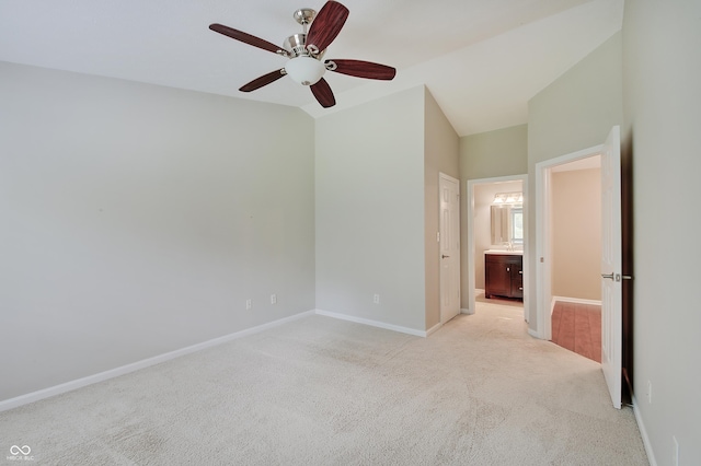 1074 Timber Creek Dr Unit 8, Carmel, IN 46032 - empty room featuring a ceiling fan, light colored carpet, baseboards, and vaulted ceiling