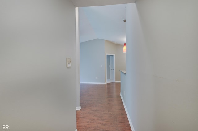 1074 Timber Creek Dr Unit 8, Carmel, IN 46032 - hallway with dark wood-type flooring, baseboards, and vaulted ceiling