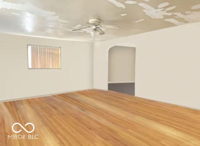 196 Bakemeyer St, Indianapolis, IN 46225 - spare room with wood finished floors, arched walkways, and ceiling fan