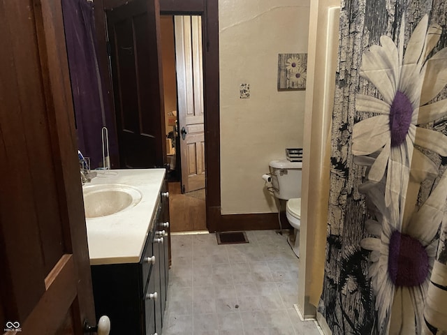 7669 W 100 N, Tipton, IN 46072 - bathroom featuring toilet, vanity, and baseboards