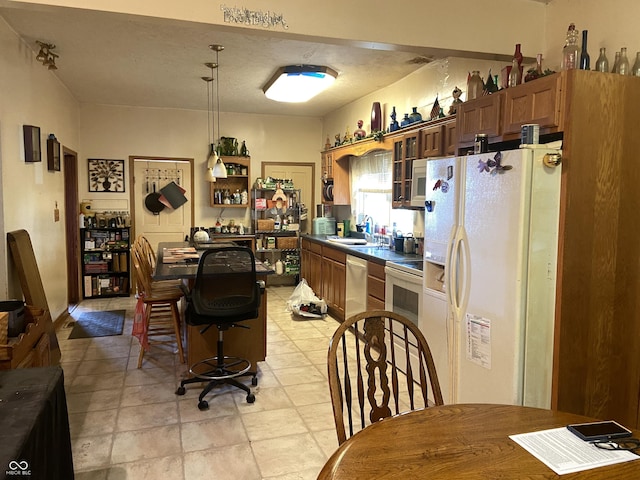 7669 W 100 N, Tipton, IN 46072 - kitchen with white appliances, dark countertops, glass insert cabinets, and a sink