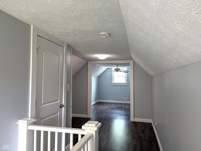 1637 Meridian St, Columbus, IN 47201 - bonus room with a textured ceiling, dark wood-type flooring, baseboards, vaulted ceiling, and a ceiling fan