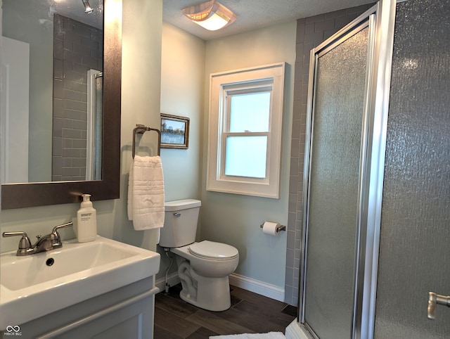 1637 Meridian St, Columbus, IN 47201 - bathroom with toilet, a shower stall, vanity, and wood finished floors