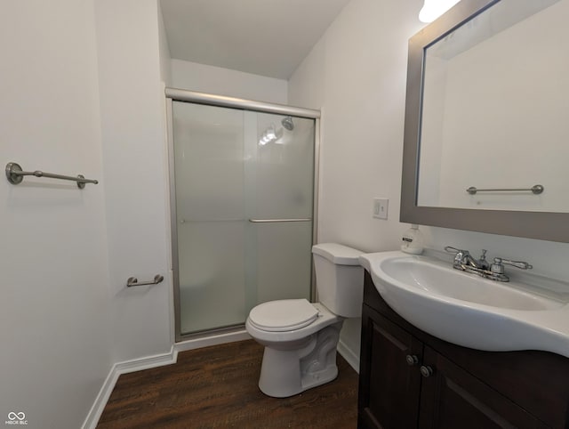 102 S W St, Milroy, IN 46156 - bathroom with wood finished floors, vanity, a stall shower, toilet, and baseboards