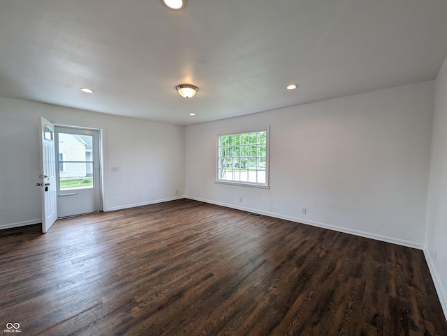 102 S W St, Milroy, IN 46156 - empty room featuring dark wood-type flooring, baseboards, and recessed lighting