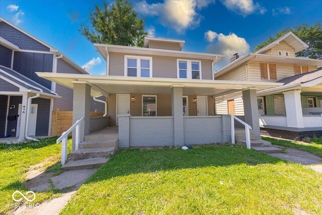 418 Eastern Ave, Indianapolis, IN 46201 - traditional style home featuring covered porch and a front lawn
