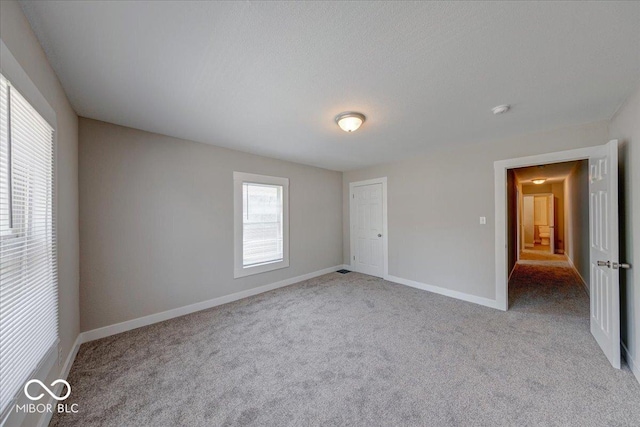 418 Eastern Ave, Indianapolis, IN 46201 - unfurnished bedroom with carpet flooring