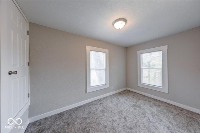 418 Eastern Ave, Indianapolis, IN 46201 - carpeted empty room featuring baseboards