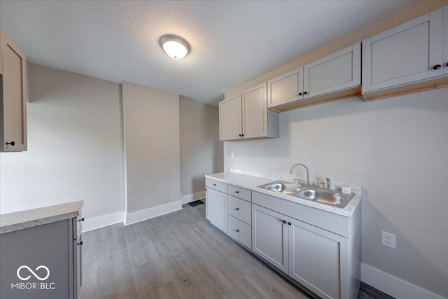 418 Eastern Ave, Indianapolis, IN 46201 - kitchen with light countertops and light wood finished floors