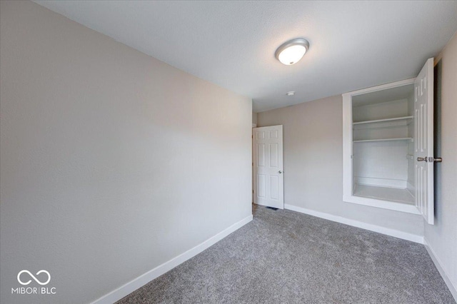 418 Eastern Ave, Indianapolis, IN 46201 - empty room featuring baseboards and carpet flooring
