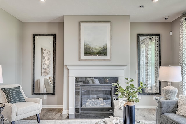 587 Bluestem Ln, New Whiteland, IN 46184 - living area with wood finished floors, baseboards, recessed lighting, and a high end fireplace