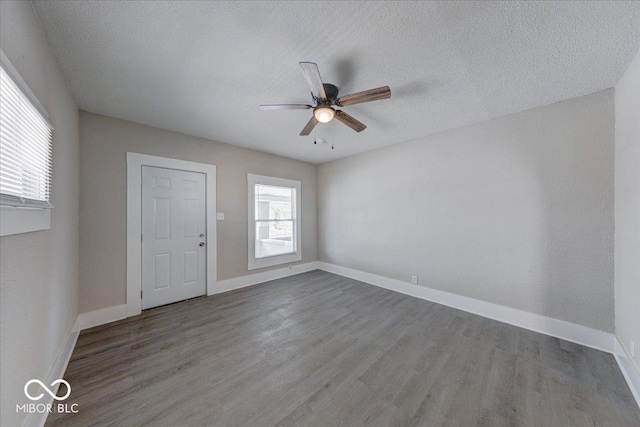 420 Eastern Ave, Indianapolis, IN 46201 - entryway with wood finished floors, a ceiling fan, and a textured ceiling