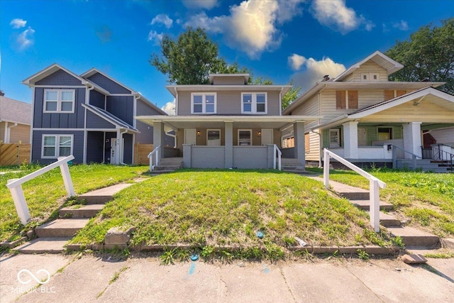420 Eastern Ave, Indianapolis, IN 46201 - view of front of property with a porch and board and batten siding