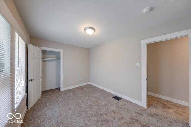 420 Eastern Ave, Indianapolis, IN 46201 - unfurnished bedroom featuring carpet flooring and a closet