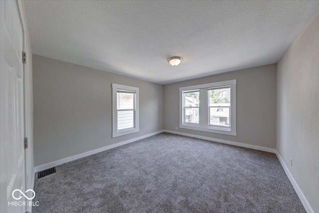 420 Eastern Ave, Indianapolis, IN 46201 - empty room with carpet floors and a textured ceiling