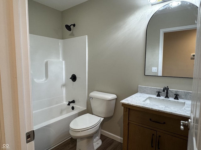 177 W Itawamba Trl, Greensburg, IN 47240 - full bathroom featuring wood finished floors, vanity, toilet, bathtub / shower combination, and baseboards