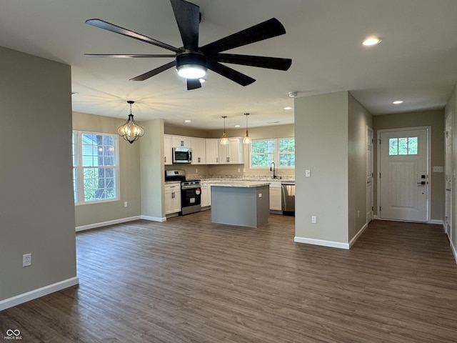 177 W Itawamba Trl, Greensburg, IN 47240 - kitchen featuring stainless steel appliances, baseboards, white cabinetry, a center island, and open floor plan
