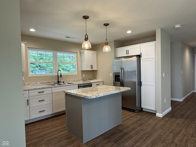 177 W Itawamba Trl, Greensburg, IN 47240 - kitchen featuring appliances with stainless steel finishes, a sink, white cabinetry, a center island, and dark wood-type flooring