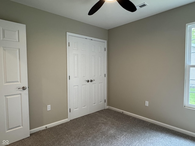 177 W Itawamba Trl, Greensburg, IN 47240 - unfurnished bedroom featuring carpet floors, a closet, multiple windows, and baseboards