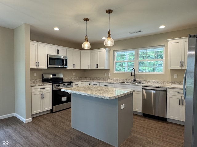 177 W Itawamba Trl, Greensburg, IN 47240 - kitchen with stainless steel appliances, a sink, white cabinets, recessed lighting, and dark wood-style flooring