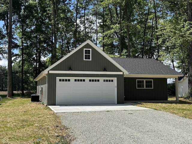 177 W Itawamba Trl, Greensburg, IN 47240 - view of front facade featuring driveway, a garage, a front lawn, and a shingled roof