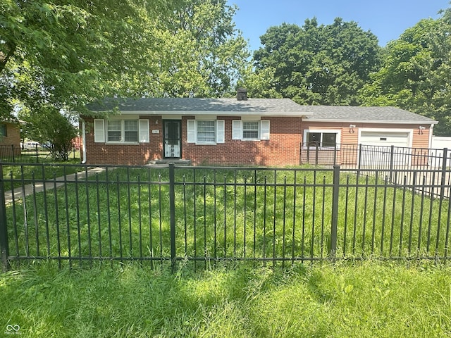 2180 N Irwin St, Indianapolis, IN 46219 - ranch-style house with a garage, brick siding, and driveway