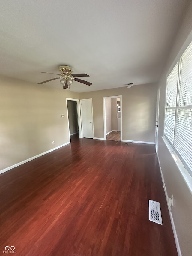 2180 N Irwin St, Indianapolis, IN 46219 - unfurnished room with a ceiling fan, dark wood-style flooring, and baseboards
