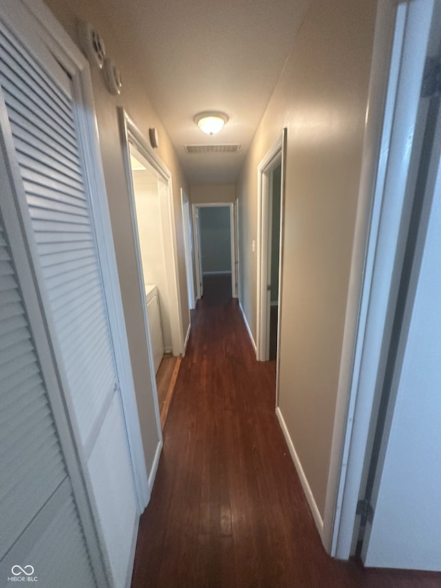 2180 N Irwin St, Indianapolis, IN 46219 - hall with dark wood-style floors and baseboards