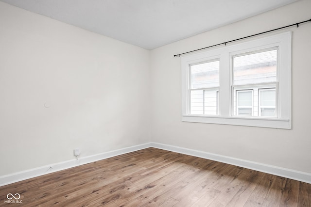 614 N Drexel Ave, Indianapolis, IN 46201 - spare room featuring baseboards and wood finished floors