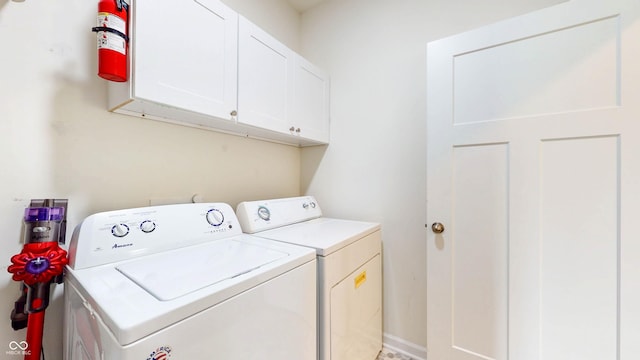 217 Saint Andrews Ave, Edinburgh, IN 46124 - washroom with washing machine and dryer and cabinet space