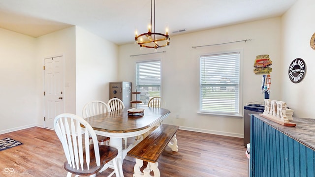 217 Saint Andrews Ave, Edinburgh, IN 46124 - dining area featuring a chandelier, wood finished floors, and baseboards
