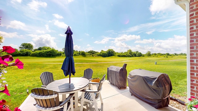 217 Saint Andrews Ave, Edinburgh, IN 46124 - view of patio / terrace featuring a grill, view of golf course, and outdoor dining space