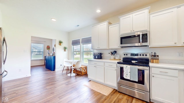 217 Saint Andrews Ave, Edinburgh, IN 46124 - kitchen with appliances with stainless steel finishes, healthy amount of natural light, light wood-type flooring, light countertops, and recessed lighting