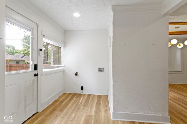 909 N Parker Ave, Indianapolis, IN 46201 - laundry room with crown molding, hookup for a washing machine, a textured ceiling, light wood-style floors, and baseboards