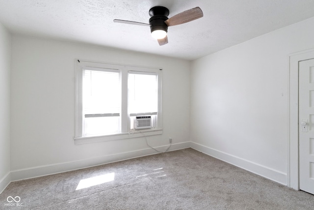 909 N Parker Ave, Indianapolis, IN 46201 - carpeted spare room with a ceiling fan, cooling unit, baseboards, and a textured ceiling