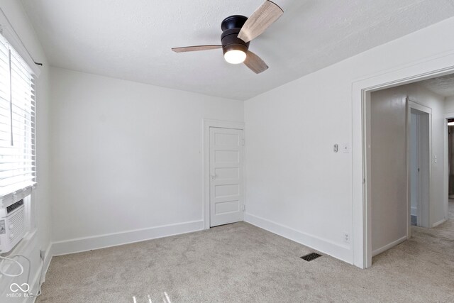 909 N Parker Ave, Indianapolis, IN 46201 - unfurnished room with a ceiling fan, light colored carpet, and baseboards