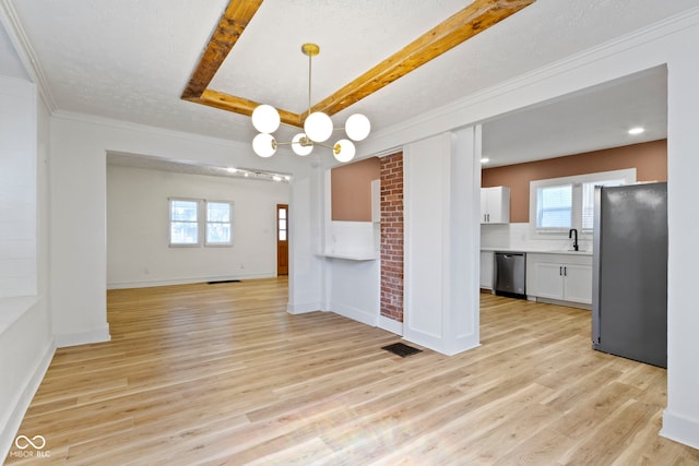 909 N Parker Ave, Indianapolis, IN 46201 - kitchen with appliances with stainless steel finishes, open floor plan, white cabinetry, light wood finished floors, and a sink