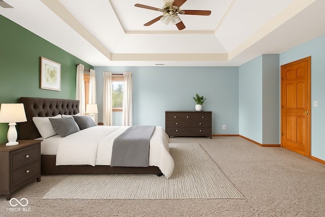 7082 Hunters Ridge Dr, Plainfield, IN 46168 - bedroom featuring a tray ceiling, carpet, and ceiling fan