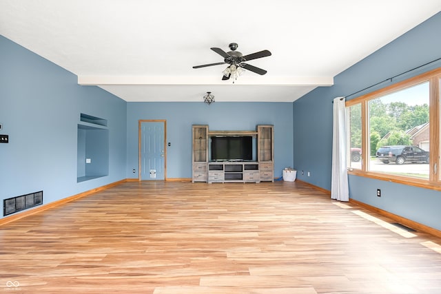 7082 Hunters Ridge Dr, Plainfield, IN 46168 - unfurnished living room featuring light wood-style flooring, a ceiling fan, and beam ceiling