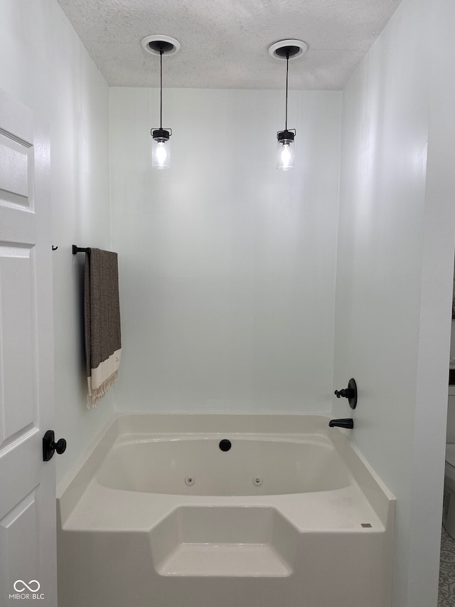 7195 W 700 N, Fairland, IN 46126 - full bath featuring a whirlpool tub and a textured ceiling