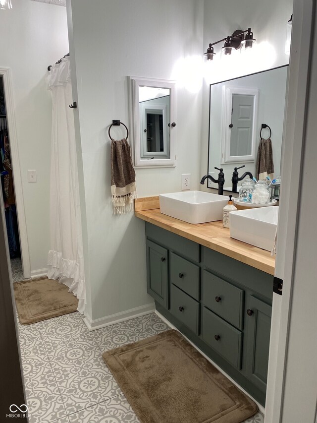 7195 W 700 N, Fairland, IN 46126 - full bathroom with double vanity, tile patterned floors, and a shower with shower curtain