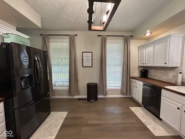 7195 W 700 N, Fairland, IN 46126 - kitchen featuring black appliances, dark wood-style flooring, white cabinets, plenty of natural light, and a textured ceiling