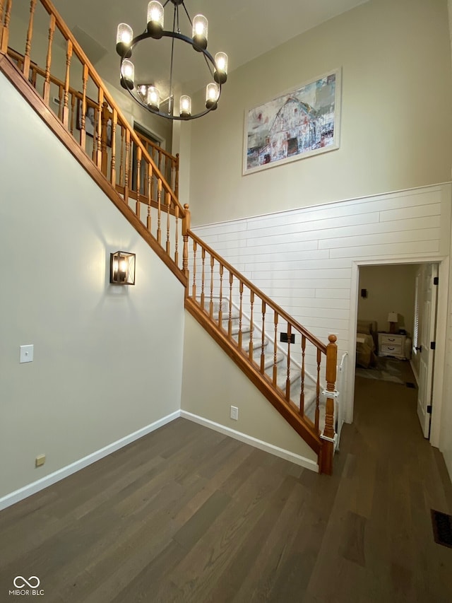 7195 W 700 N, Fairland, IN 46126 - stairway featuring wood finished floors and a chandelier