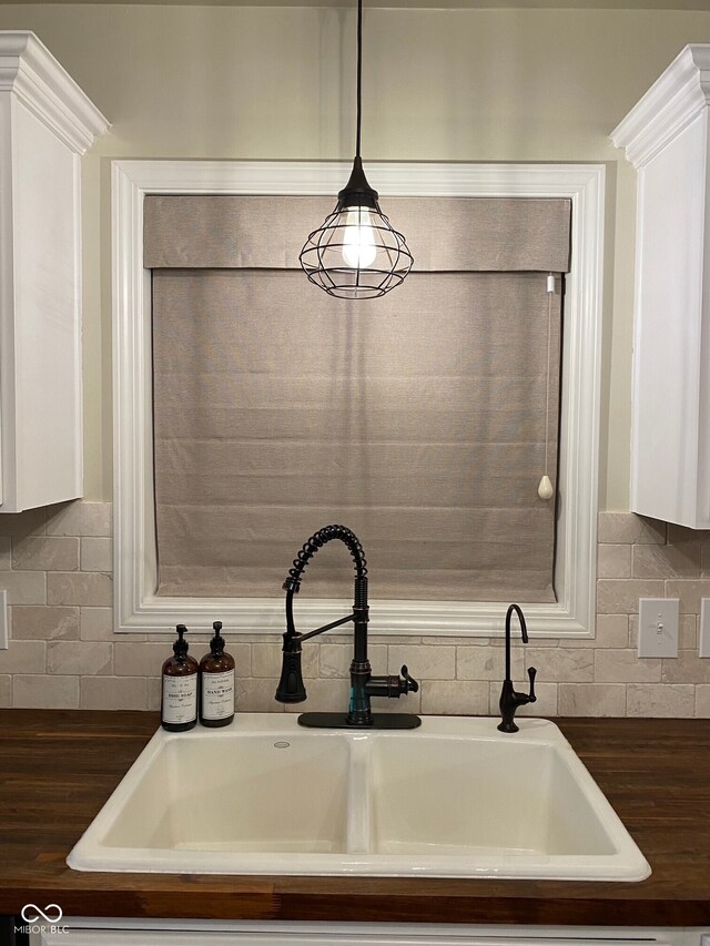 7195 W 700 N, Fairland, IN 46126 - kitchen view of white cabinets, wooden counters, decorative backsplash, and decorative light fixtures