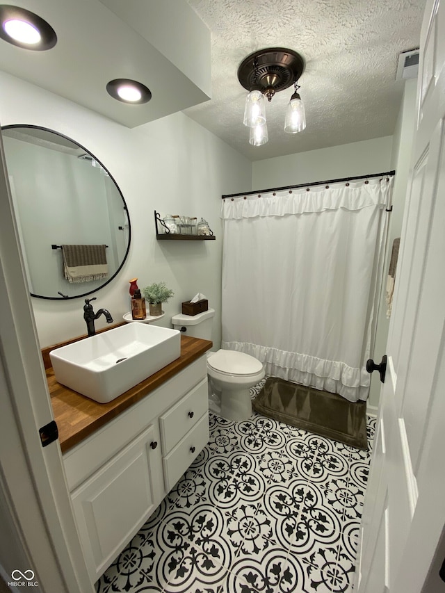 7195 W 700 N, Fairland, IN 46126 - bathroom with vanity, a textured ceiling, and shower / bath combination with curtain