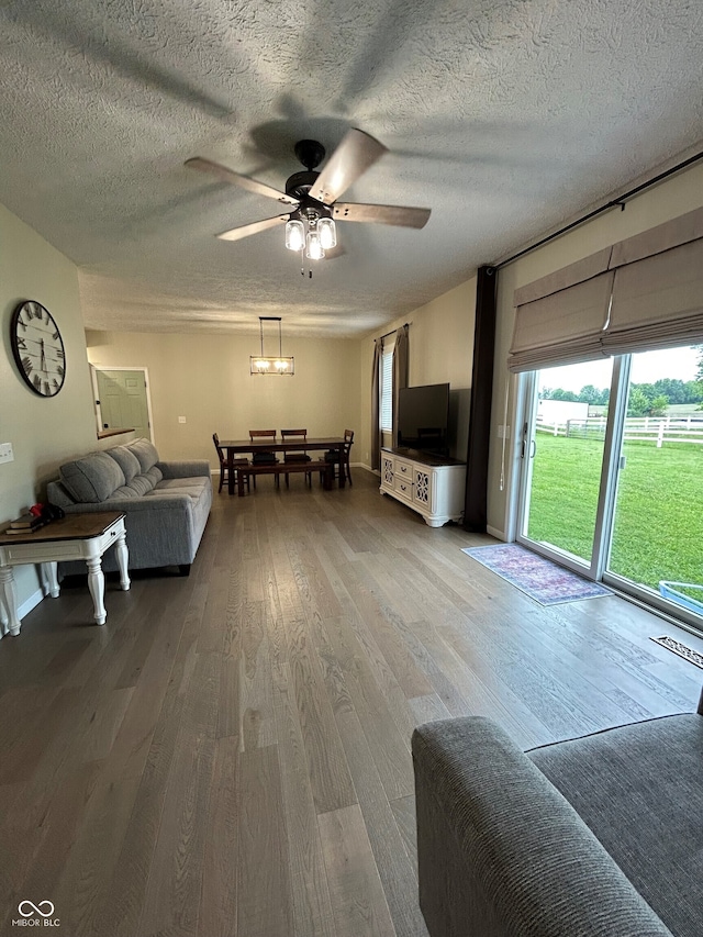 7195 W 700 N, Fairland, IN 46126 - living area featuring ceiling fan, wood finished floors, and a textured ceiling