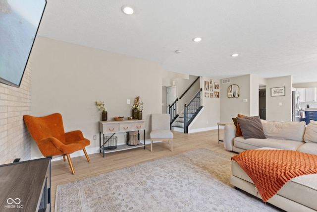 2580 Bluewood Way, Plainfield, IN 46168 - living room with stairway, wood finished floors, and recessed lighting